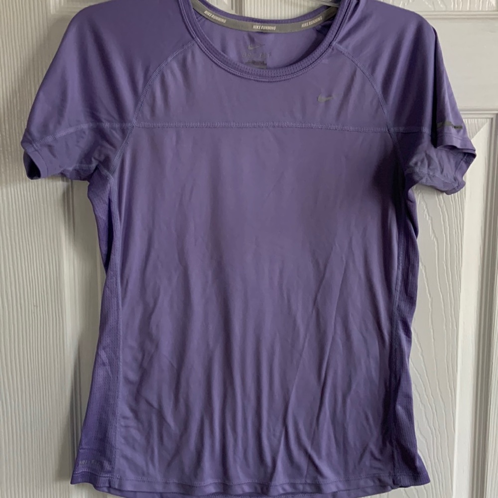 Nike ladies running top. DriFit wick away material. No signs of wear